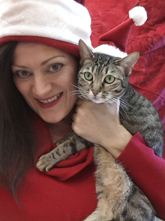 Rachael and Cat wearing red Santa Hats